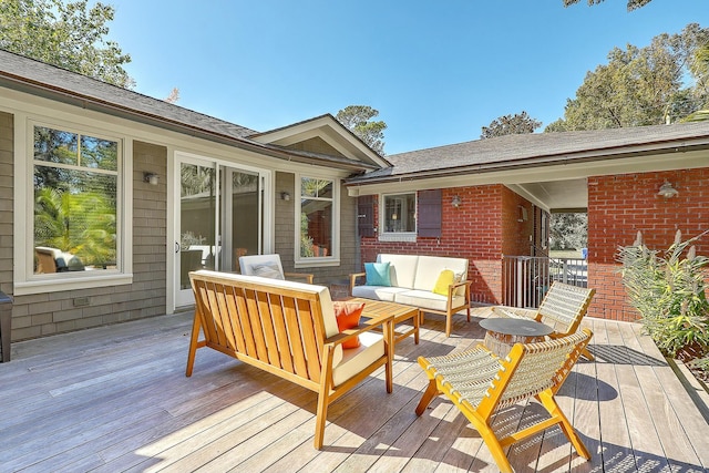 wooden terrace with outdoor lounge area