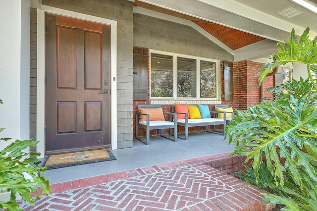 doorway to property featuring covered porch