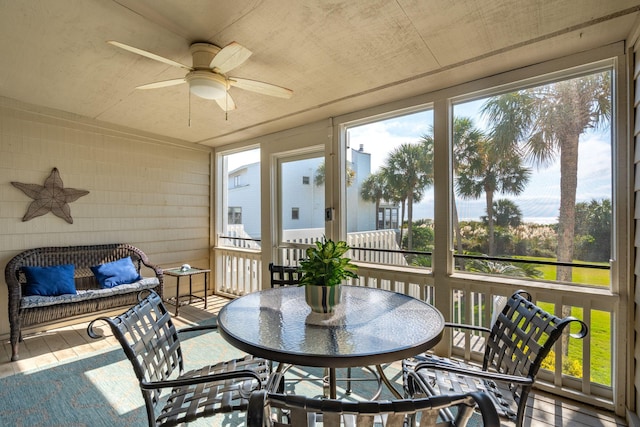 sunroom with ceiling fan and plenty of natural light