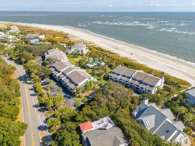 drone / aerial view featuring a water view and a beach view