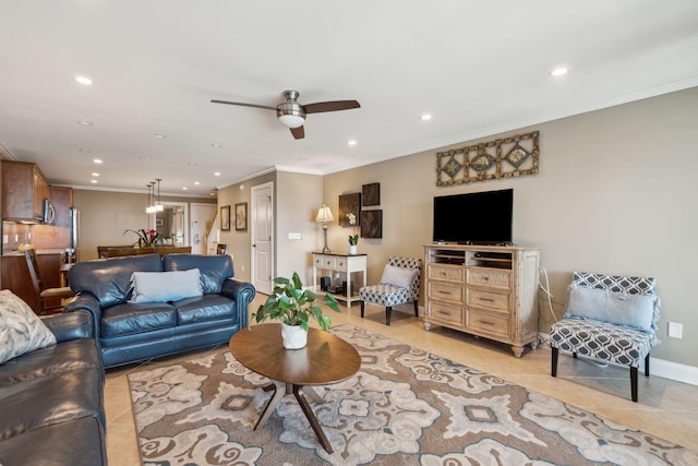 tiled living room featuring ceiling fan and crown molding