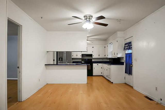 kitchen featuring white cabinetry, black range, light hardwood / wood-style floors, kitchen peninsula, and ceiling fan