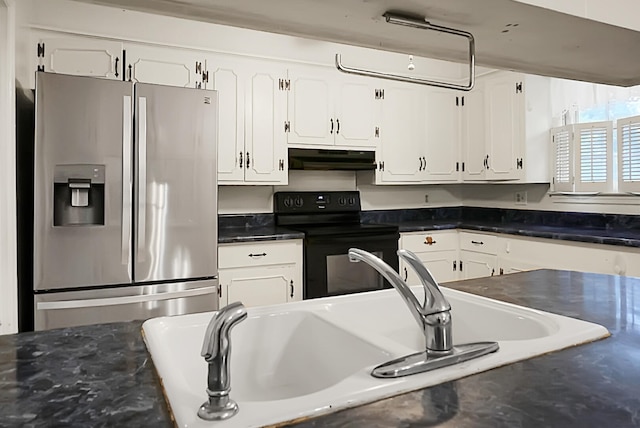 kitchen featuring stainless steel refrigerator with ice dispenser, white cabinetry, sink, and black electric range