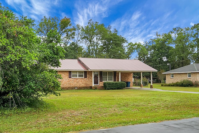 single story home featuring a front lawn and a carport