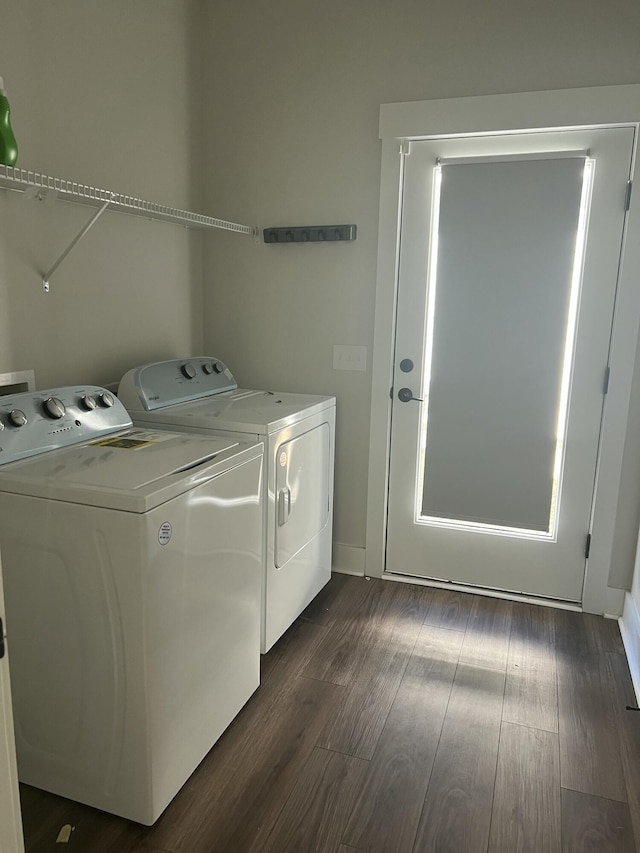 laundry room featuring separate washer and dryer and dark hardwood / wood-style floors