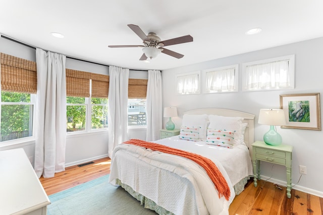 bedroom featuring hardwood / wood-style flooring and ceiling fan