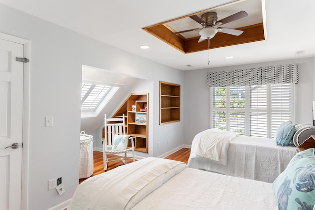 bedroom with lofted ceiling, hardwood / wood-style flooring, and ceiling fan