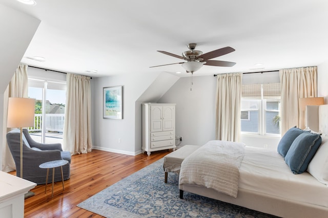 bedroom featuring access to exterior, ceiling fan, and hardwood / wood-style flooring