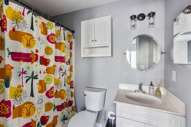 bathroom featuring a shower with curtain, vanity, and toilet