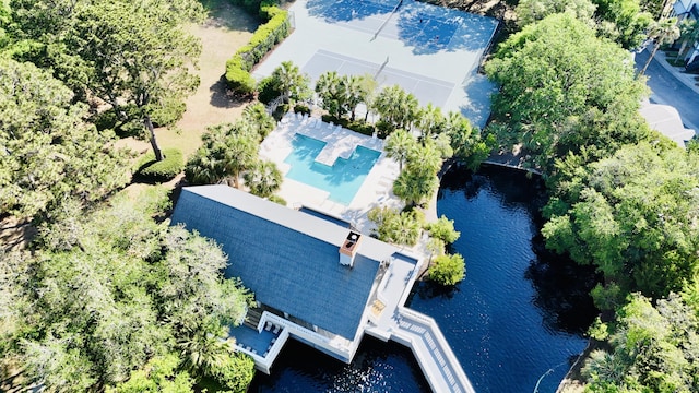 bird's eye view of a pool and a nearby body of water