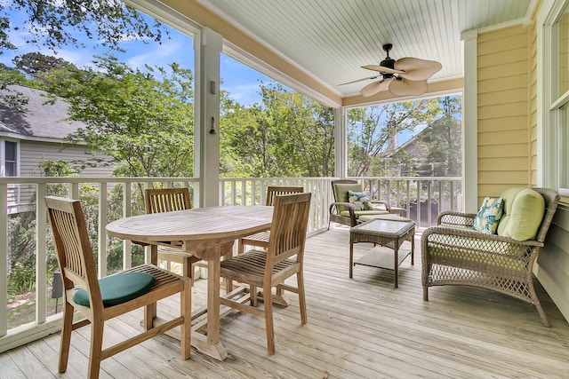 sunroom with ceiling fan and an outdoor hangout area