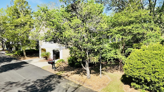 view of property exterior featuring driveway