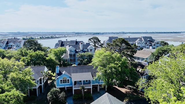 aerial view of residential area featuring a nearby body of water