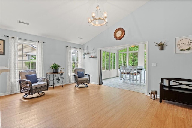 3486 Ashwycke St, Mount Pleasant, SC 29466 - living area featuring a chandelier, wood finished floors, and high vaulted ceiling