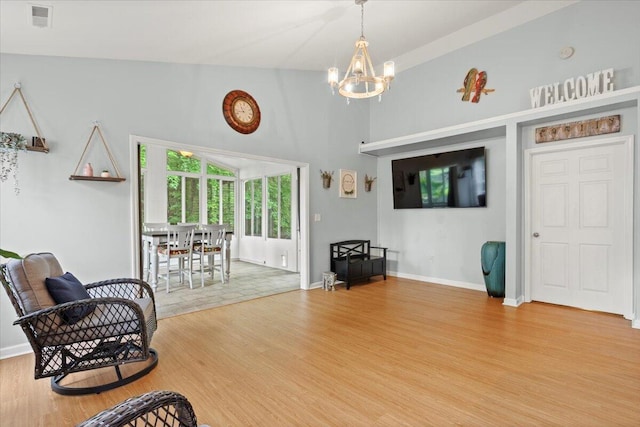 3486 Ashwycke St, Mount Pleasant, SC 29466 - living area featuring a chandelier, wood finished floors, and a towering ceiling