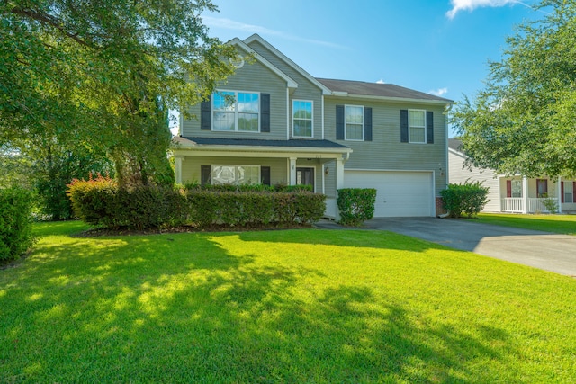 view of front of house featuring a garage and a front yard