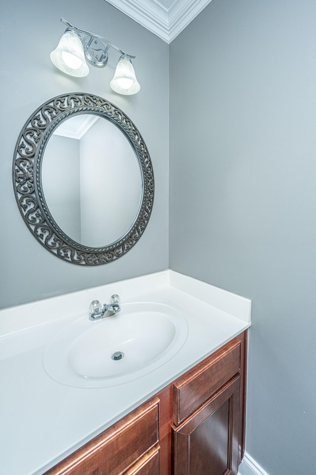 bathroom featuring crown molding and vanity