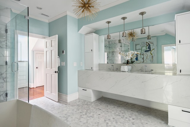 bathroom with walk in shower, crown molding, and sink