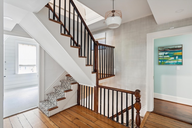 stairway with hardwood / wood-style floors