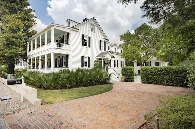 view of front of property with a balcony