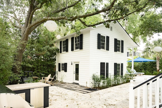 rear view of house featuring a patio area