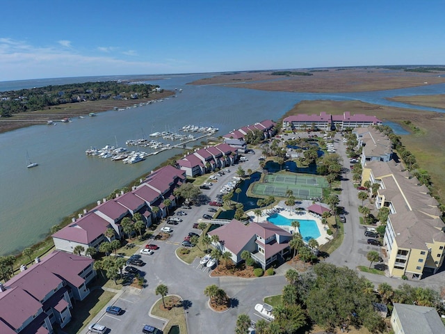 birds eye view of property with a water view