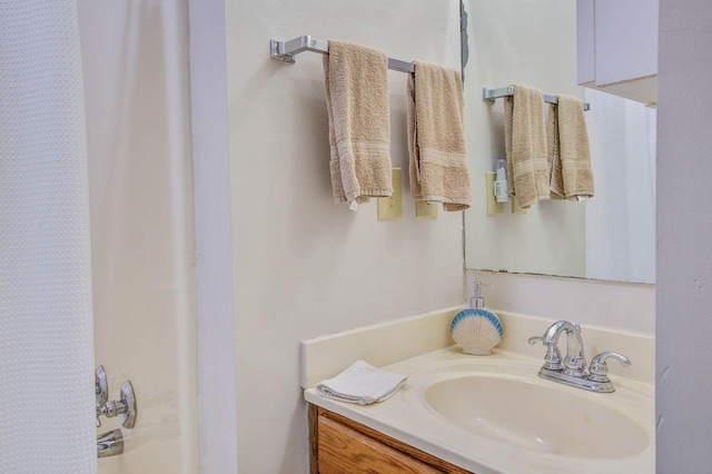 bathroom with vanity and shower / bath combo