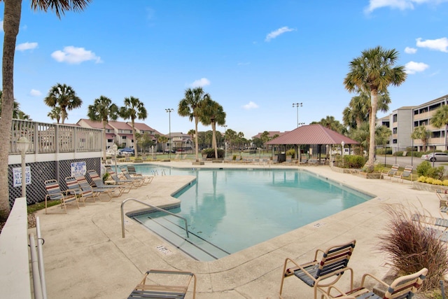 view of swimming pool featuring a gazebo and a patio area