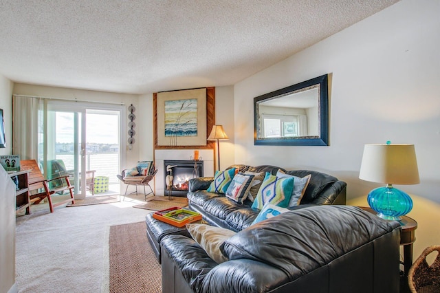 living room featuring carpet flooring and a textured ceiling