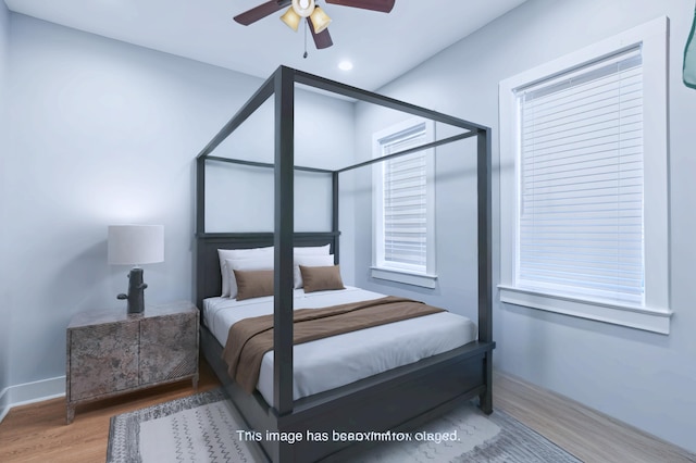 bedroom featuring ceiling fan and hardwood / wood-style flooring