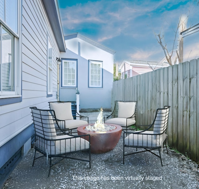 view of patio with a fire pit