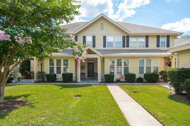 5511 Colonial Chatsworth Cir N, Charleston, SC 29418 - view of front facade with a front lawn, board and batten siding, and roof with shingles
