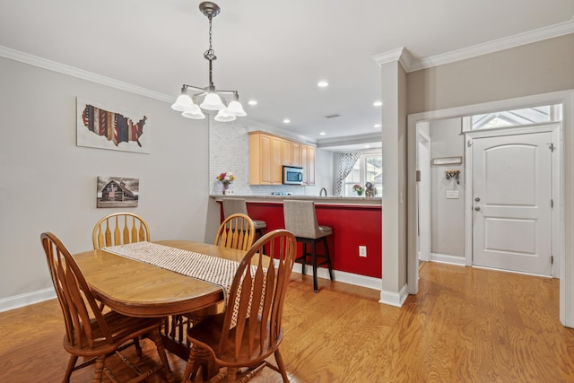 5511 Colonial Chatsworth Cir N, Charleston, SC 29418 - dining room with light wood-style floors, crown molding, a chandelier, and recessed lighting