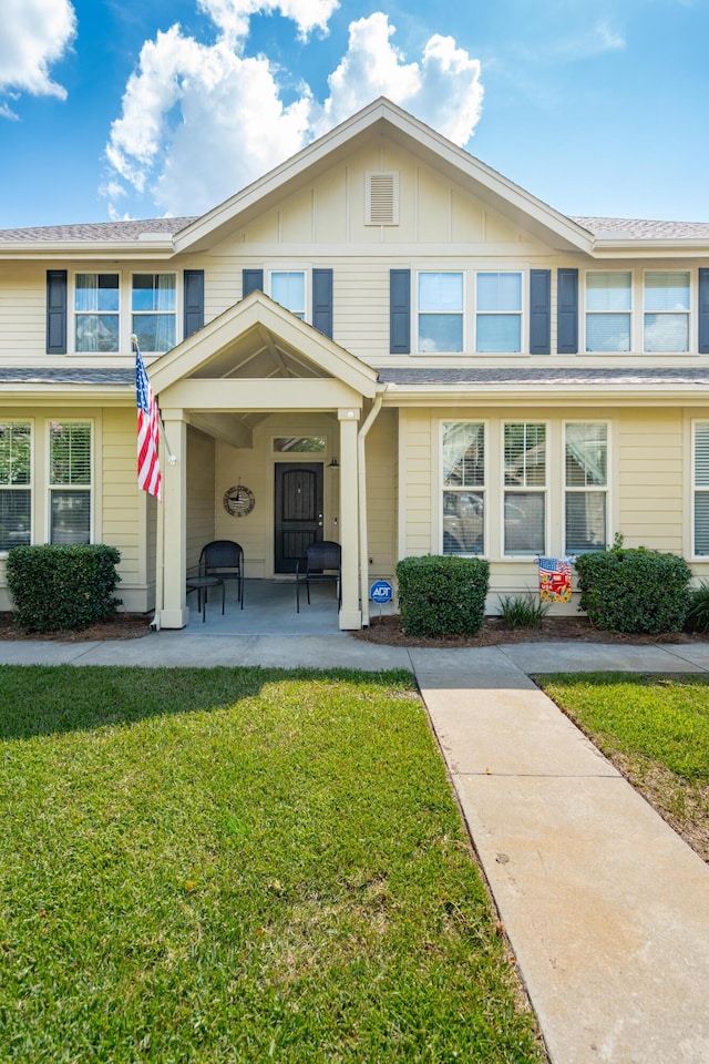 5511 Colonial Chatsworth Cir N, Charleston, SC 29418 - view of front of home with a front yard and board and batten siding