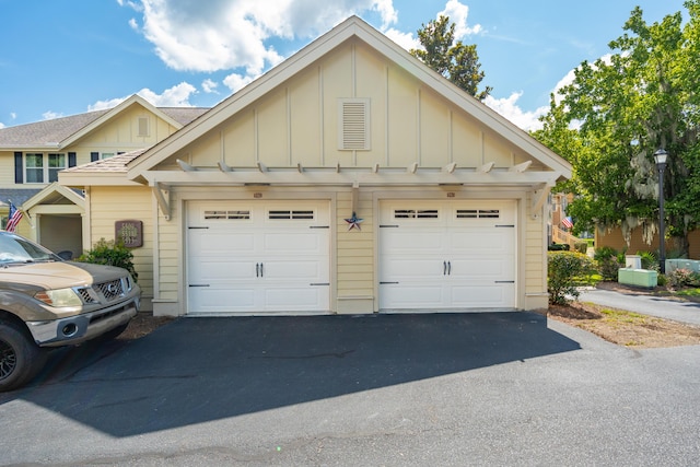 5511 Colonial Chatsworth Cir N, Charleston, SC 29418 - garage with asphalt driveway