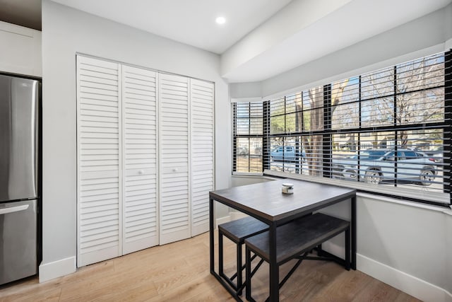 dining area featuring light wood-style floors, recessed lighting, and baseboards