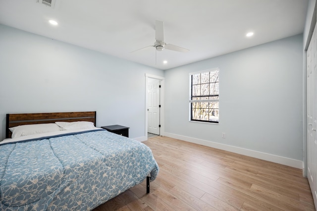 bedroom featuring visible vents, baseboards, wood finished floors, and recessed lighting