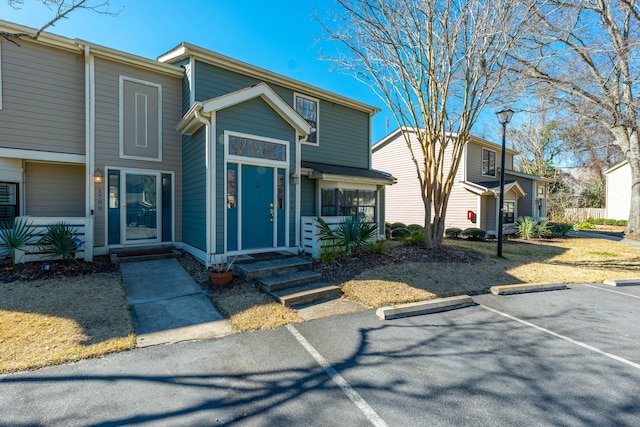 view of front of house with uncovered parking