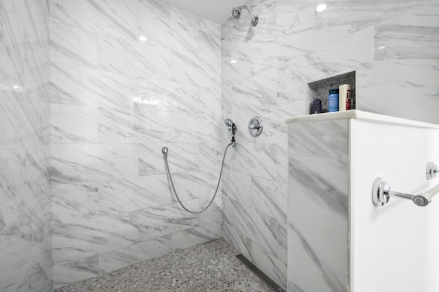 bathroom with a tile shower