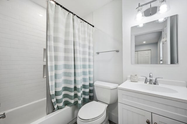 full bathroom featuring shower / tub combo, vanity, and toilet