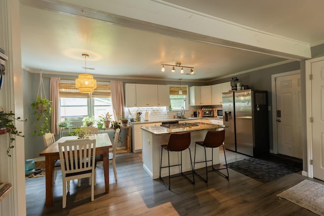 716 White Oak Dr, Charleston, SC 29407 - kitchen with a sink, white cabinetry, a center island, ornamental molding, and appliances with stainless steel finishes