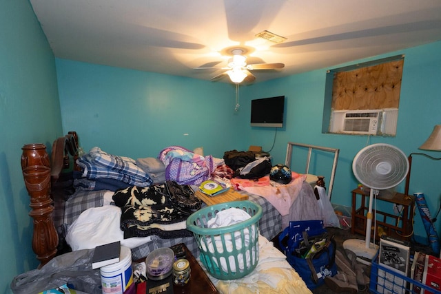 bedroom featuring cooling unit and ceiling fan