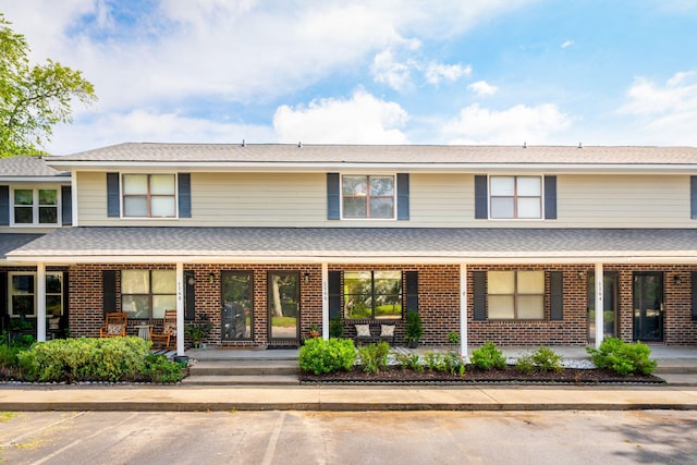 1166 Julian Clark Rd, Charleston, SC 29412 - view of front of home featuring covered porch, brick siding, and uncovered parking