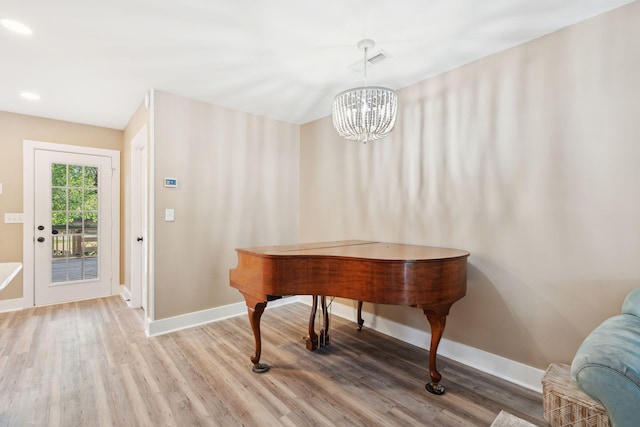 1166 Julian Clark Rd, Charleston, SC 29412 - dining area with wood finished floors, a chandelier, baseboards, and recessed lighting