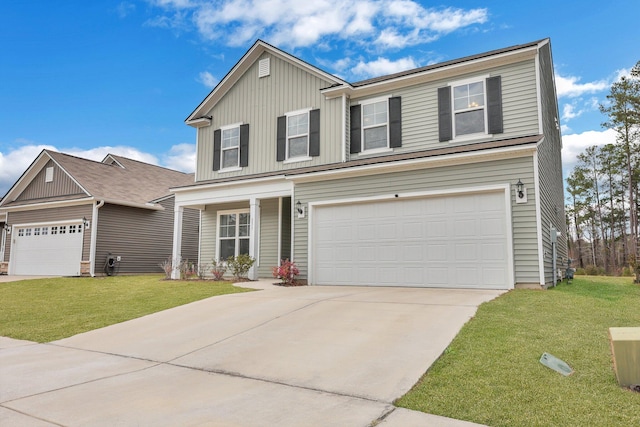 view of front of property with an attached garage, driveway, a front yard, and board and batten siding