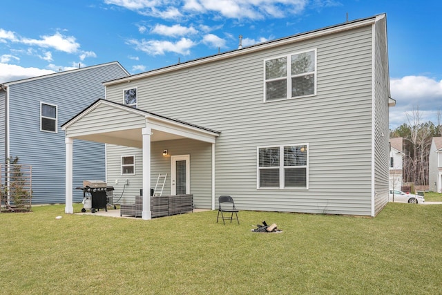 back of house featuring a yard