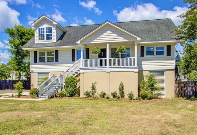 1834 Cornish Ave, Charleston, SC 29412 - view of front of house featuring stairs, a shingled roof, a front yard, and a porch