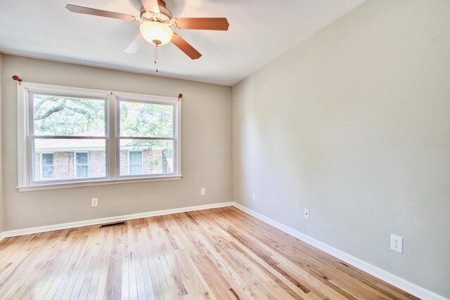 1834 Cornish Ave, Charleston, SC 29412 - empty room with a healthy amount of sunlight, baseboards, hardwood / wood-style floors, and visible vents