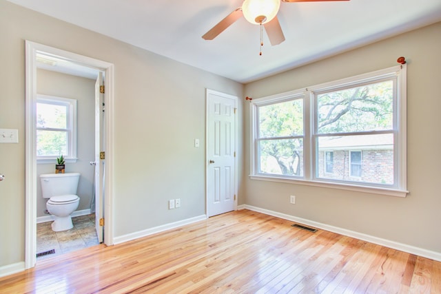 1834 Cornish Ave, Charleston, SC 29412 - unfurnished bedroom with ceiling fan, wood-type flooring, baseboards, ensuite bathroom, and visible vents