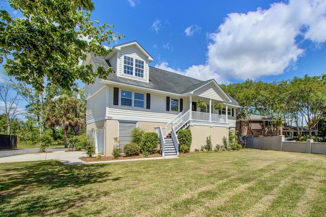 1834 Cornish Ave, Charleston, SC 29412 - view of front of home with a garage, covered porch, a front yard, concrete driveway, and stairway